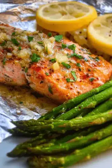 Baked Salmon in Foil with Asparagus and Garlic Butter Sauce
